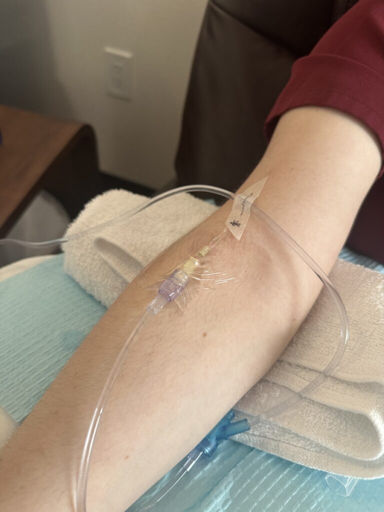 Patient with IV therapy in arm