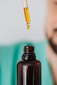 close up of a bottle and dropper