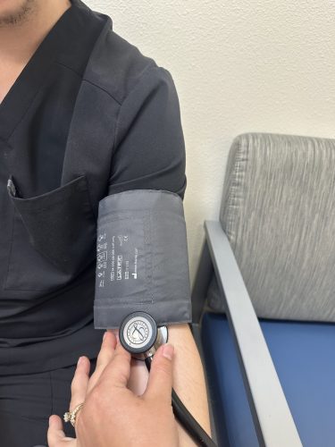 Patient having blood pressure taken